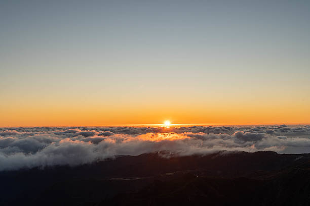 istock Sunset Above the Clouds Over Mountain Peaks 2208011240
