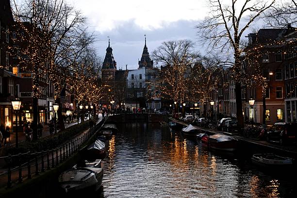 istock Amsterdam canal at dusk into night 2208024917