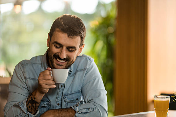 istock Young man relaxing on coffee break in cafe. 2208026355