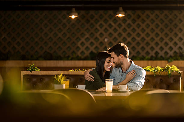 istock Tranquil couple relaxing together in cafe. 2208026397