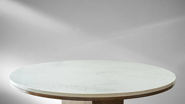 istock Round marble table top with abstract shadow drop on white wall background for mockup product display 2208027575