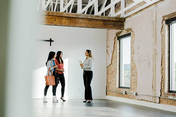 istock Two Women Discussing a Commercial Real Estate Space with Agent 2208039775