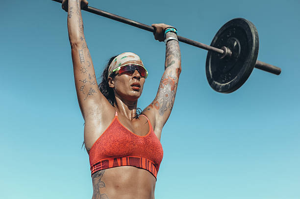 Women Weightlifting on the Beach