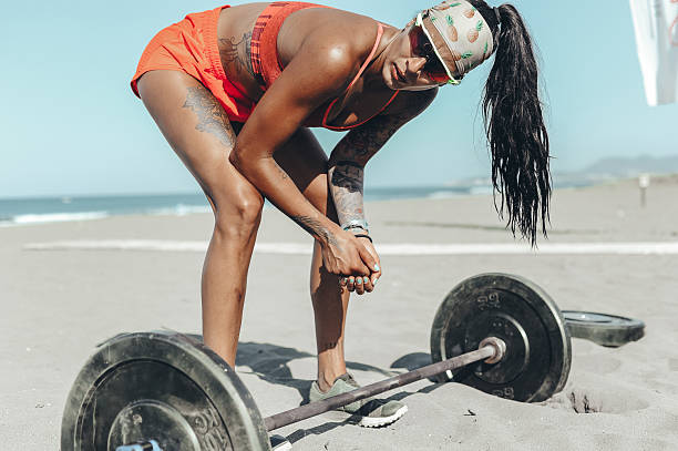 istock Fitness Enthusiast Taking a Break During Beach Workout 2208040355