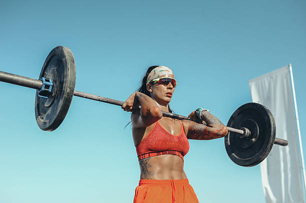 istock Outdoor Woman Weightlifting 2208040358