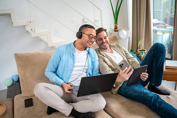 istock Hispanic and Caucasian Men Sharing a Productive Day at Home 2208040465