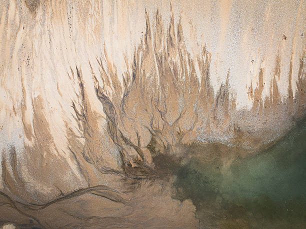 istock WATER DRAWINGS ON THE SAND FROM A TOP VIEW 2208040968