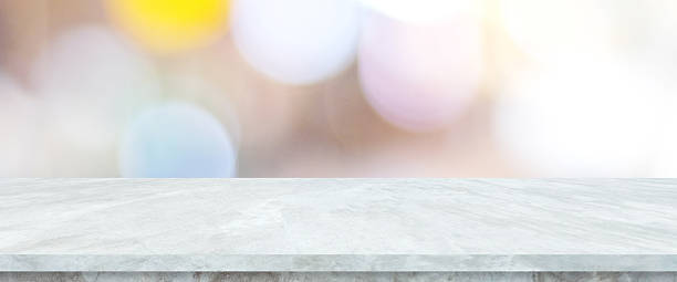 istock Empty white table top, counter, desk background over blur  bokeh background, White marble stone table, shelf and blurred kitchen restaurant for food, product display mockup, template 2208041325