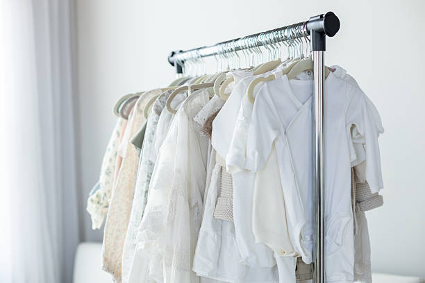 istock Clothing rack showcasing neutral colored garments 2208041337