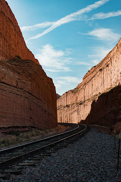 istock Railroad Tracks Winding Through a Towering Red Rock Canyon 2208042910
