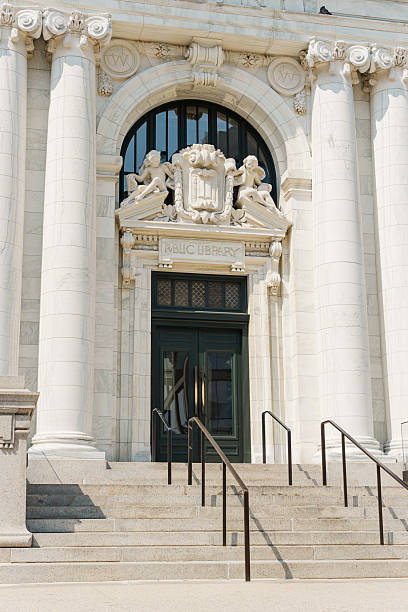 istock Public library entrance with marble columns and carved details. 2208043039