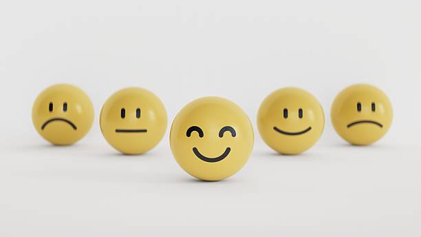 Customer service evaluation, feedback, and satisfaction survey concept. yellow BALL blocks with a cute smiley emoticon with emotion faces on white background with copy space.