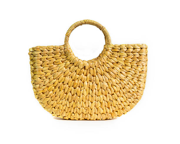 Handmade bag made by utilizing natural water hyacinth material, isolated on white background. concept of rural local wisdom, product from waste to reduce global warming.