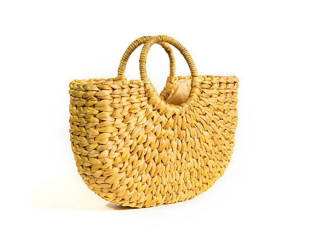 istock Handmade bag made by utilizing natural water hyacinth material, isolated on white background. concept of rural local wisdom, product from waste to reduce global warming. 2208045087