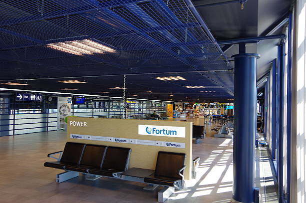 Oulu, Finland - 19 Jul 2016: Oulu Airport interior seats and Fortum power plug socket outlet. Fortum Oyj is a Finnish state-owned energy company located in Espoo, Finland. It mainly focuses on the Nordic region. Fortum operates power plants, including co-generation plants, and generates and sells electricity and heat. Oulu Airport is located in Oulu, Finland. The airport is the third busiest airport in Finland after Helsinki-Vantaa and Rovaniemi airport, as measured by the number of passengers and landings. There are around 10 daily flights to Helsinki.