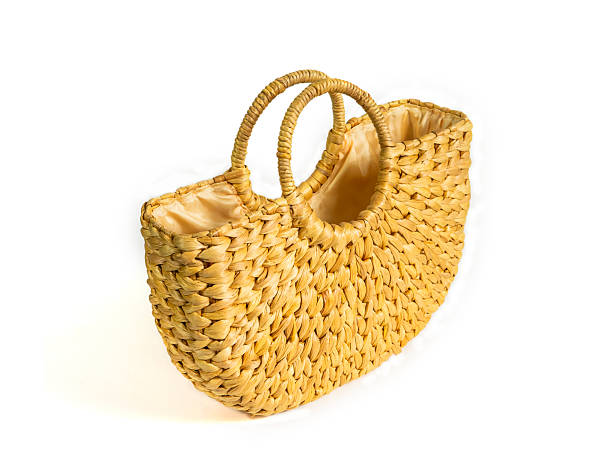 istock Handmade bag made by utilizing natural water hyacinth material, isolated on white background. concept of rural local wisdom, product from waste to reduce global warming. 2208045633