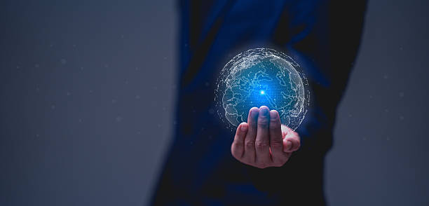 istock Businessman holds a glowing digital globe, symbolizing global connectivity and technology in a modern context. 2208046576