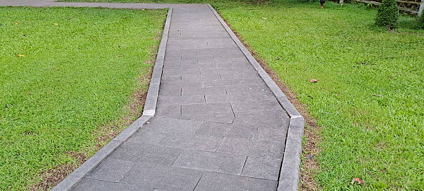 istock Park pedestrian walkway against green grass 2208051385