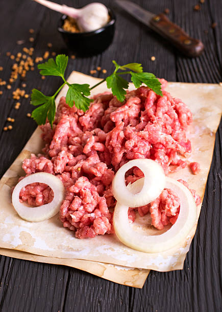 istock Raw minced pork. Black background. Top view. Space for text 2208055456
