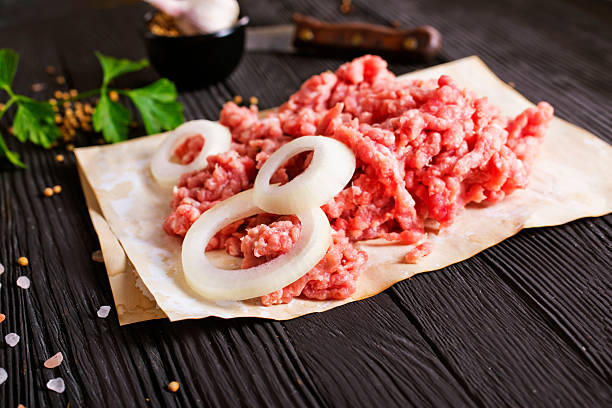 istock Raw minced pork. Black background. Top view. Space for text 2208055459
