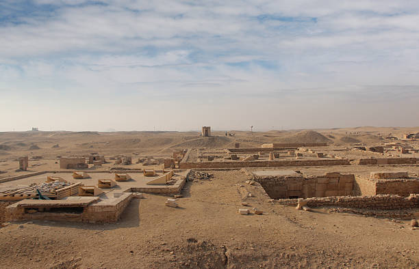 istock An Egyptian and camel at Pyramid Complex of Djoser 2208055688
