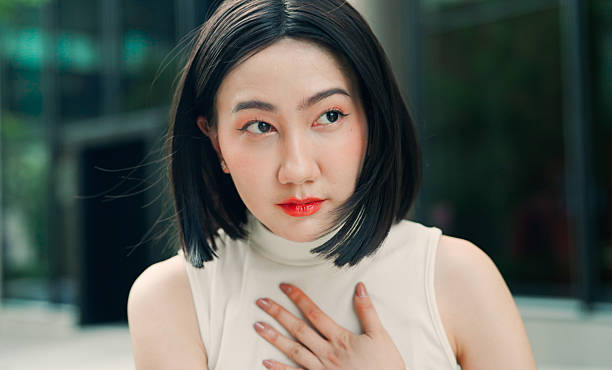 istock Asian woman tightness on chest 2208064348