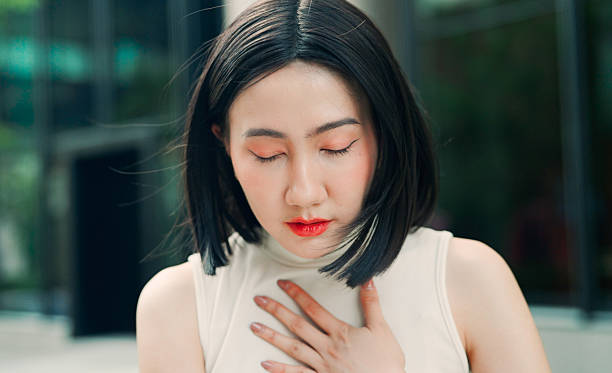istock Asian woman tightness on chest 2208064784