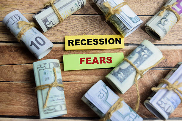 istock Concept Recession Fears on sticky notes on a wooden table with dollar bills 2208065345