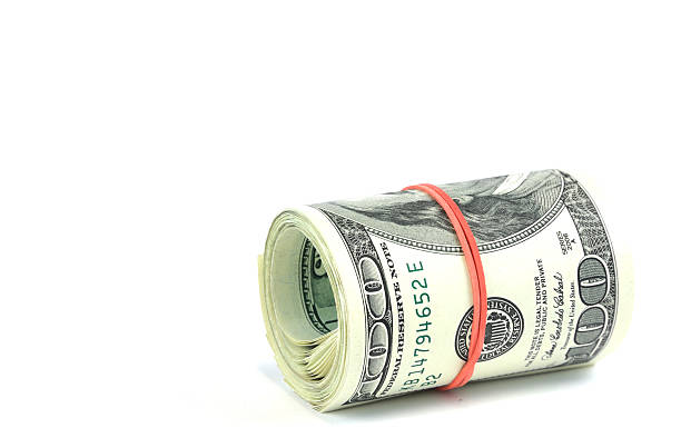 istock roll of hundred USA dollar bills with red rubber 2208067411