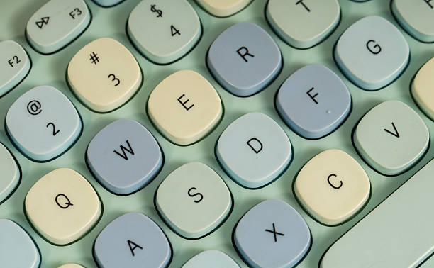 istock Close up of a modern computer keyboard with a cute, contemporary blue design seen from above. 2208067548