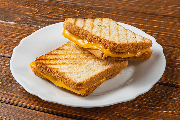 istock Grilled cheese sandwich served on a white plate for brunch or lunch needs 2208068420