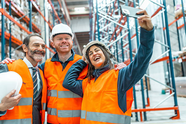 istock Warehouse workers taking selfie in logistics center 2208069055