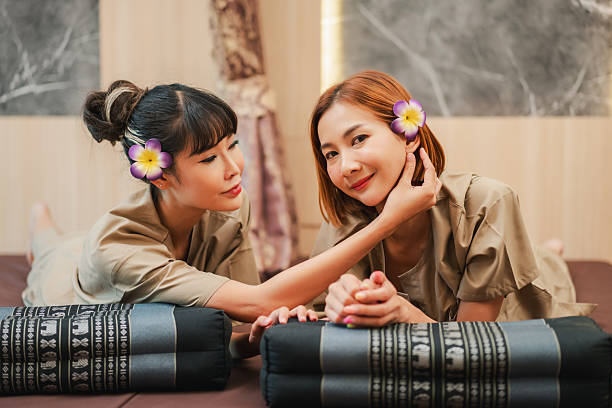 Relaxed woman receiving a professional massage at a tranquil spa.