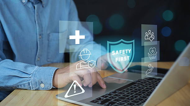 istock Work Safety and Compliance Concept, Safety First, Businessman touching check mark in shield icon. hard hat, checklist, workplace safety, health protocols, and regulatory compliance 2208070033