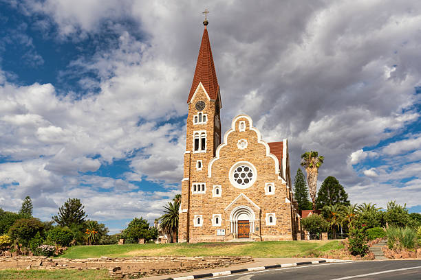 Windhoek Christ Church - Christuskirche in Downtown Windhoek, Capital City of Namibia under blue sky with fluffy summer clouds. The Christ Church - Christuskirche is maybe the main iconic symbol of Windhoek City. Windhoek, Namibia, Southern Africa