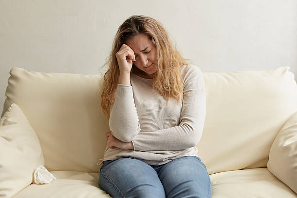 istock Sad pensive Middle aged woman 2208071088