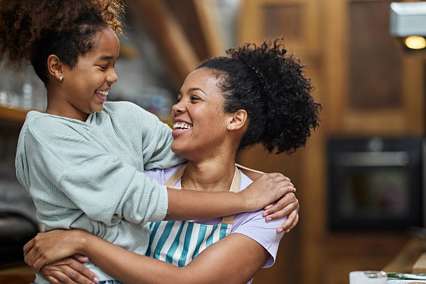 istock Happy single black mother and daughter talking at home. 2208071756