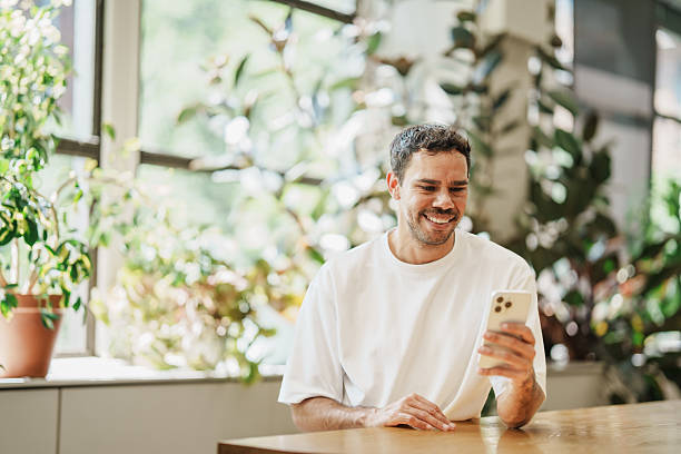 istock Confident Aboriginal professional checking his phone in a modern office 2208071792