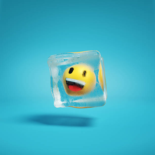 istock Emoji grinning face with red tongue inside ice cube. 2208071820