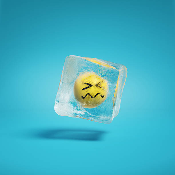 istock Confounded face with crumpled mouth emoji inside ice cube. 2208071853