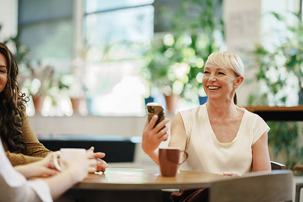 istock Female colleagues exchanging ideas during a relaxed moment at work 2208071894