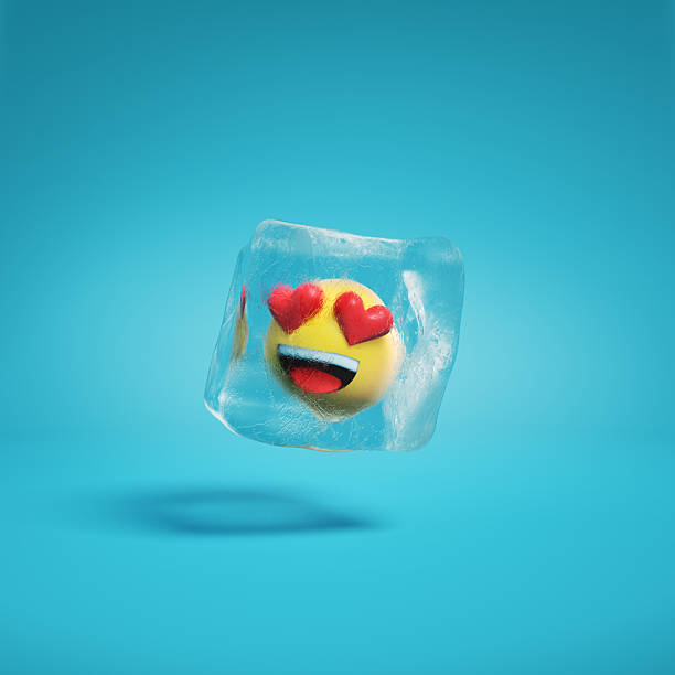 istock Smiling face with heart-eyes emoji with hearts for eyes inside ice cube. 2208071960
