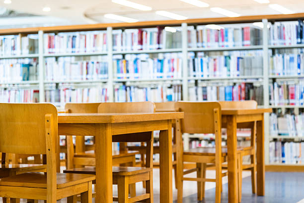 istock Public library with wooden tables and chairs 2208072630