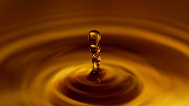 istock Freeze Motion of Splashing Whiskey or Coffee Drop. 2208077579