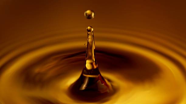 istock Freeze Motion of Splashing Whiskey or Coffee Drop. 2208077618