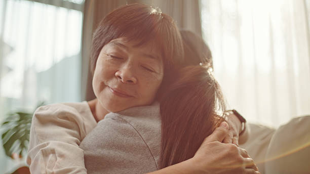 istock Mother and daughter hugging. 2208079021