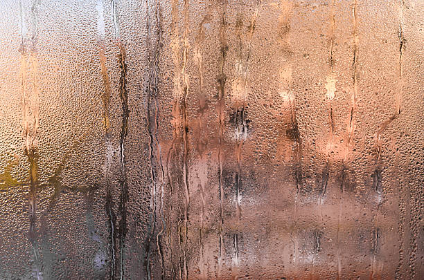 istock drops of water on wet glass. abstract background 2208079156