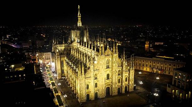 istock Aerial Night View of Illuminated Milan Cathedral 2208079519