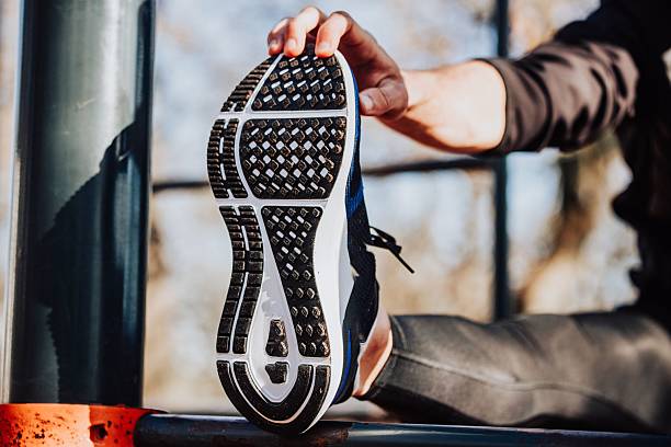 istock Athletic Shoe Stretching Close-Up 2208081516