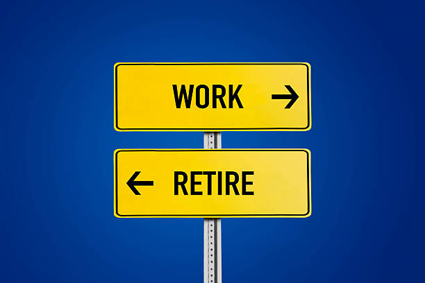 istock Work or retire road sign 2208084360